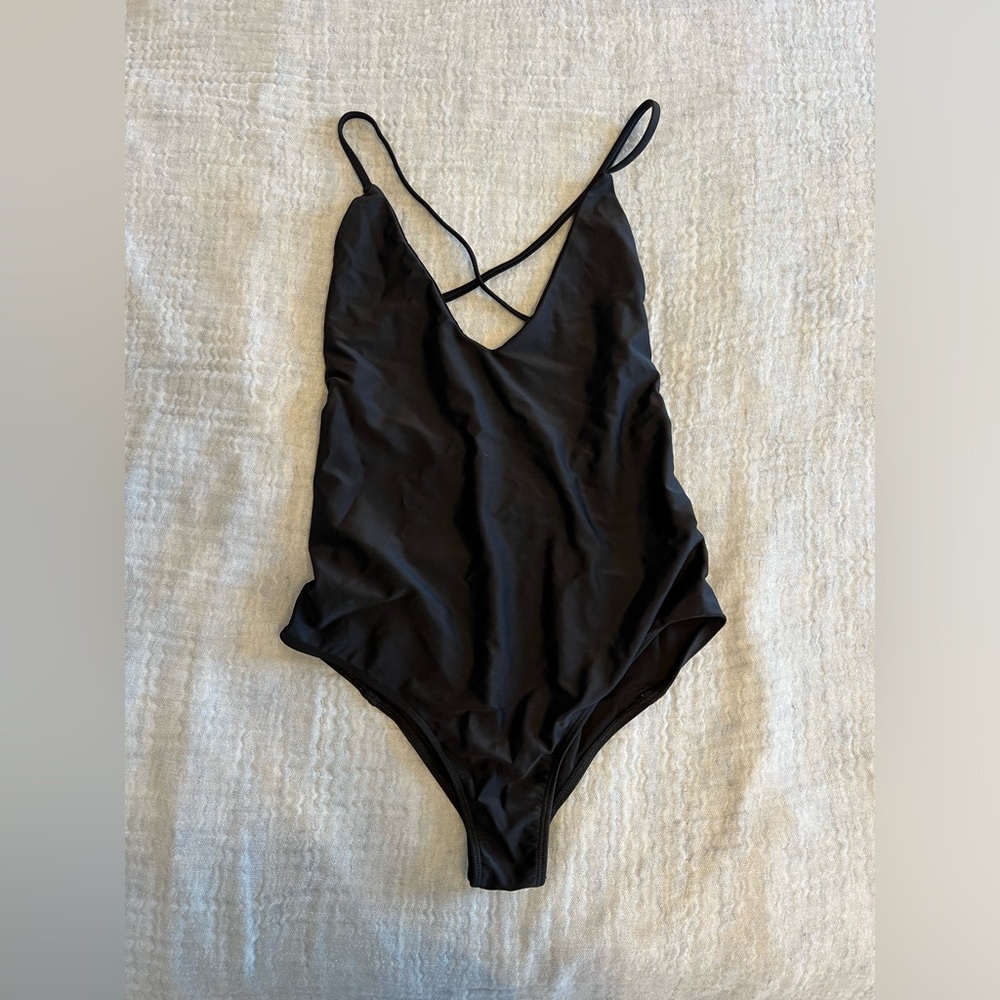 Black strappy one piece bathing suit